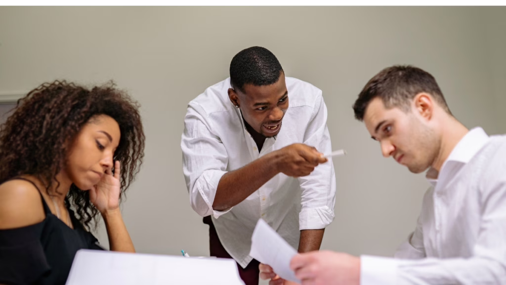 Team meeting with a passionate disagreement highlighting the need for constructive conflict among founders.
